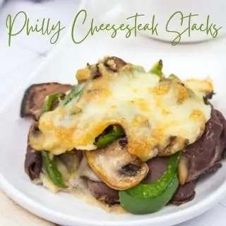 philly cheesesteak stacks on a white plate