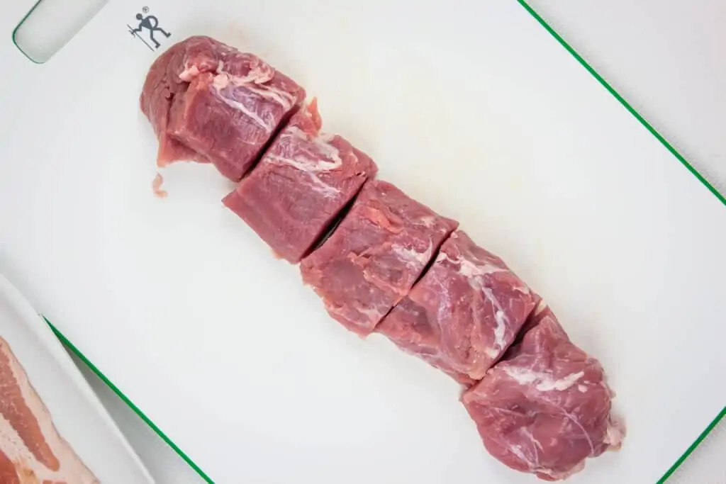 a pork tenderloin cut into equal portions