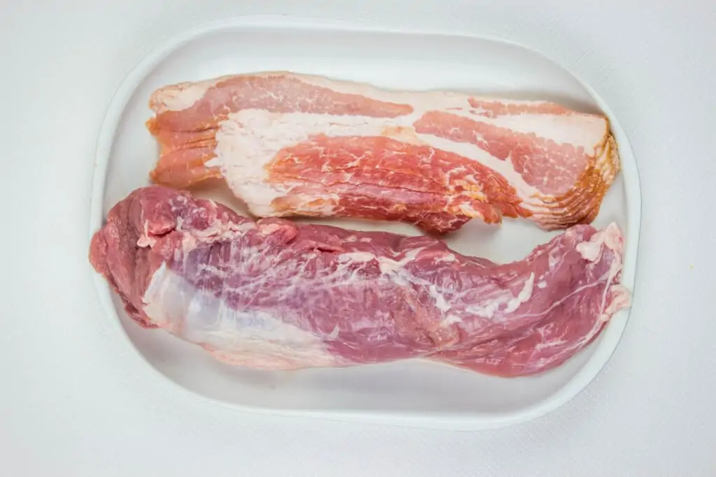 Pork tenderloin on a plate to make bacon wrapped pork tenderloin
