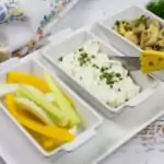 keto blue cheese dip on a serving tray with vegetable sticks and marinated mushrooms