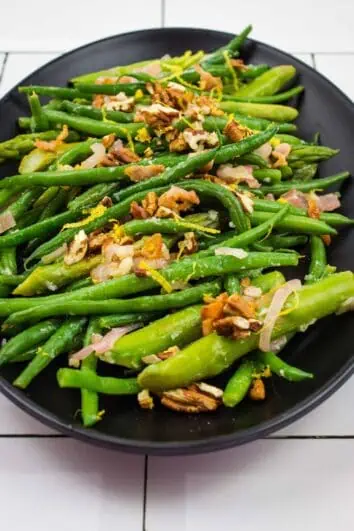 keto asparagus and green beans on a black plate