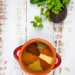 keto chili spice mix on a table with veggies in the background