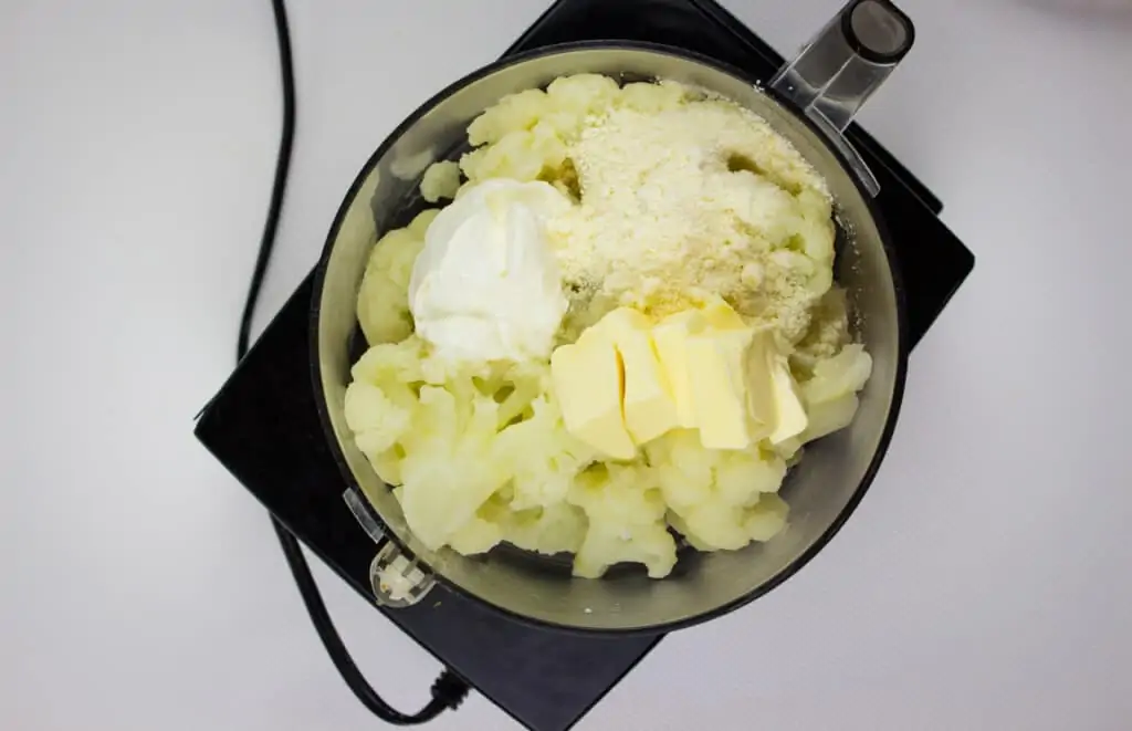 add the keto cauliflower mash ingredients to the food process and pulse until smooth