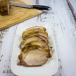 brown sugar mustard glaze pork roast on a platter