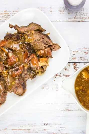 keto pot roast with bacon on a serving platter with gravy