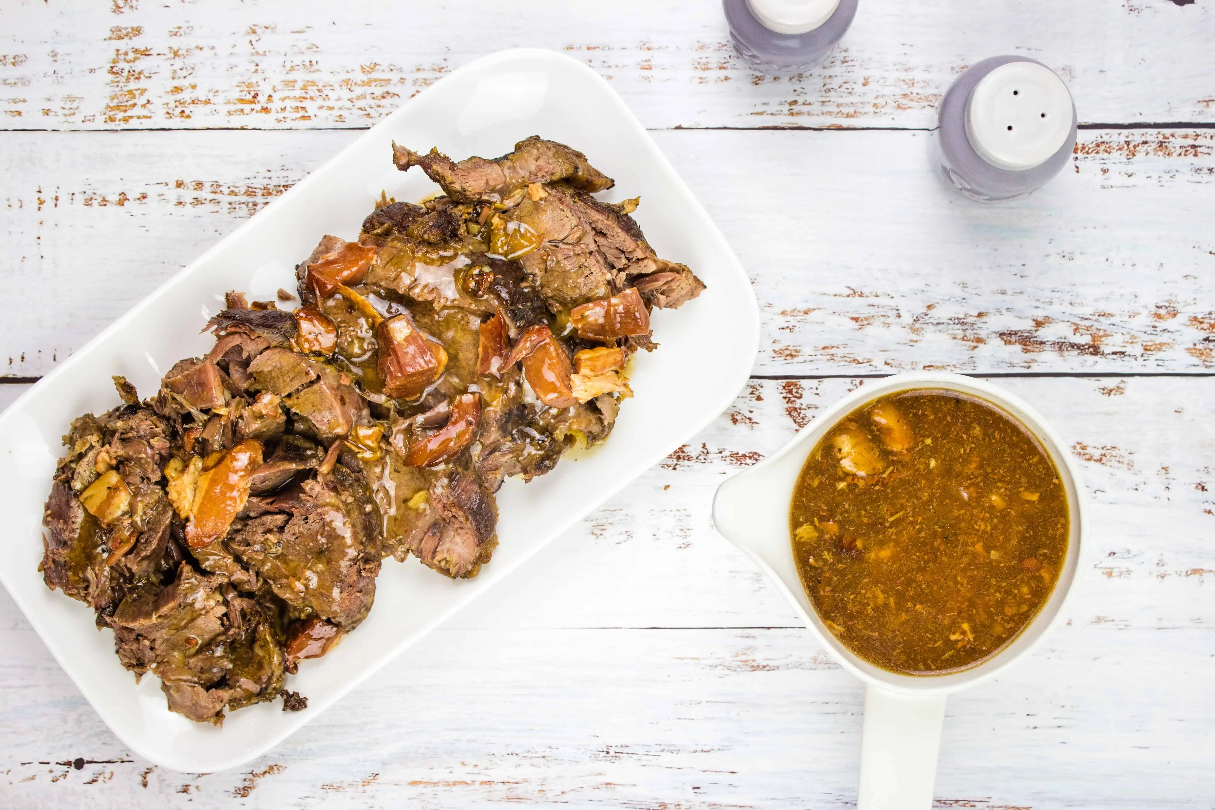 keto pot roast with bacon on a serving platter with gravy