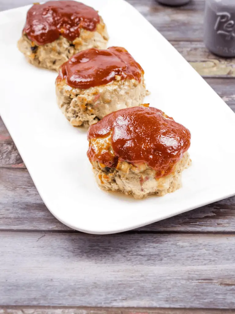 3 of best meatloaf on the planet on a white plate