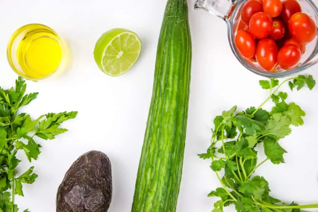 ingredients to make cucumber, tomato, avocado salad