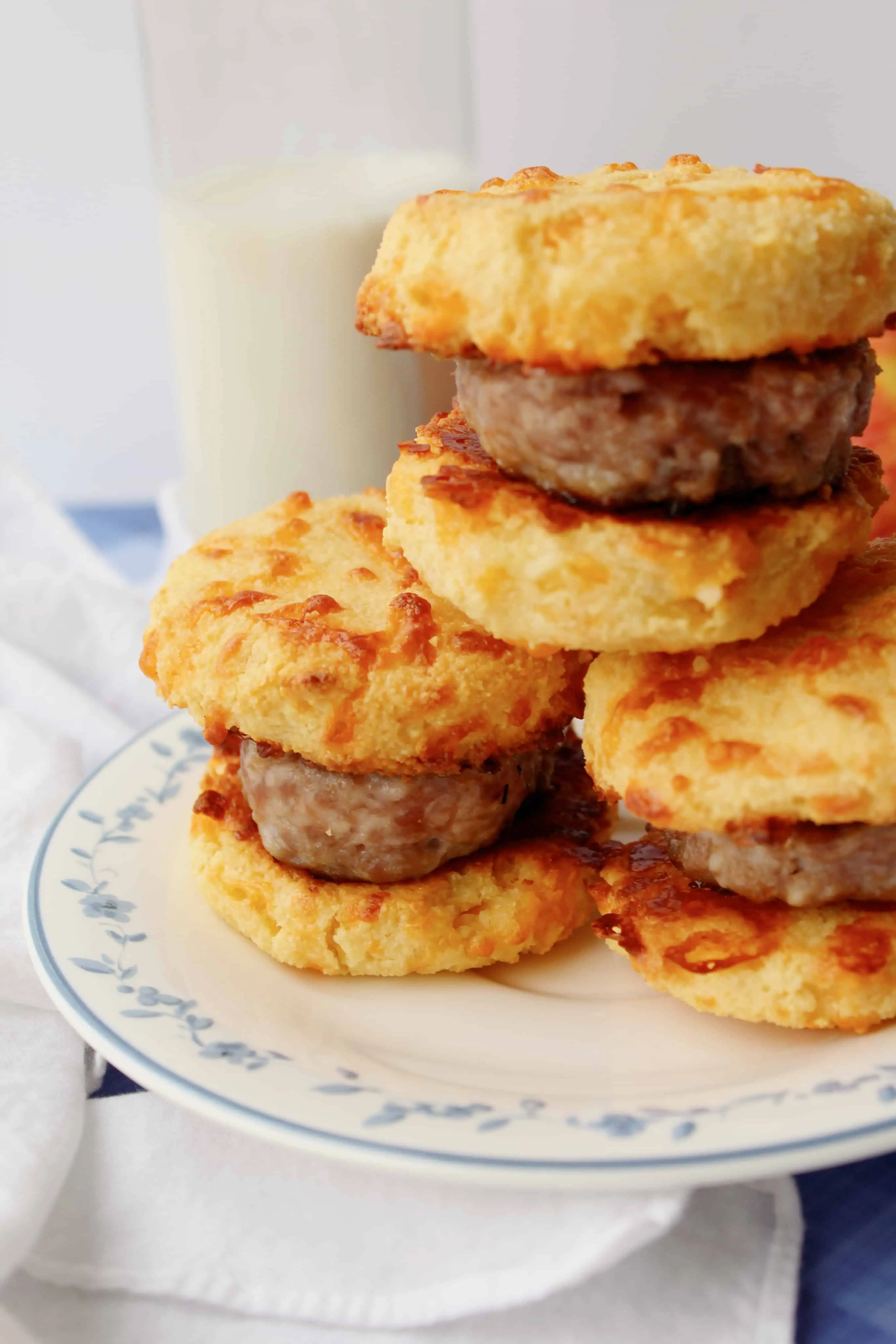 a stack of keto sausage biscuit sandwiches on a plate
