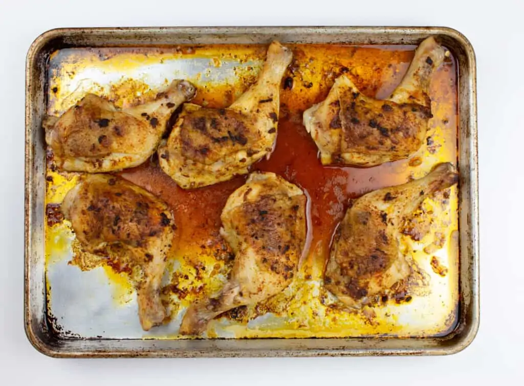 Oven-roasted peruvian chicken on a sheet pan. 
