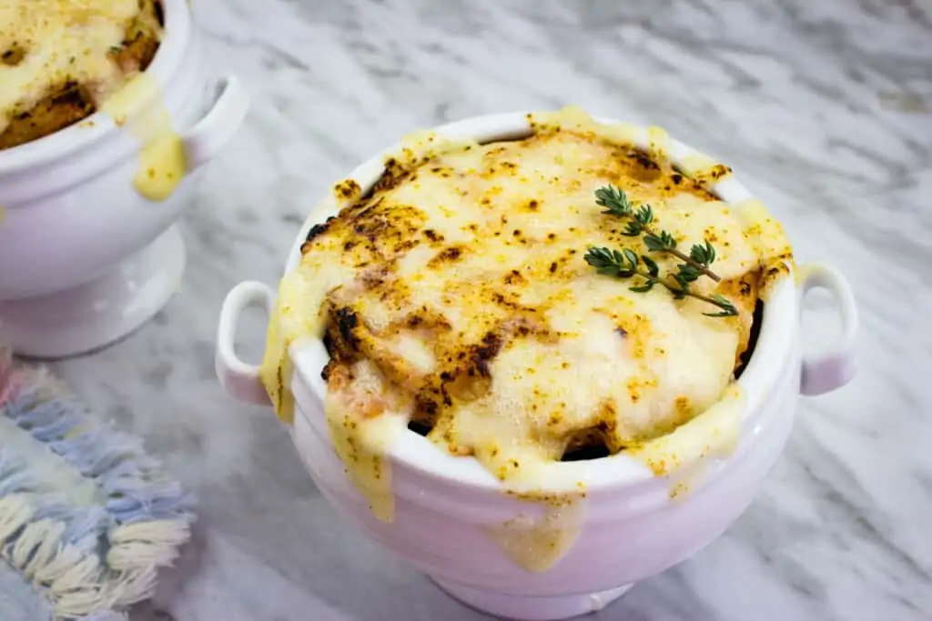 Keto french onion soup topped with a cheesy layer