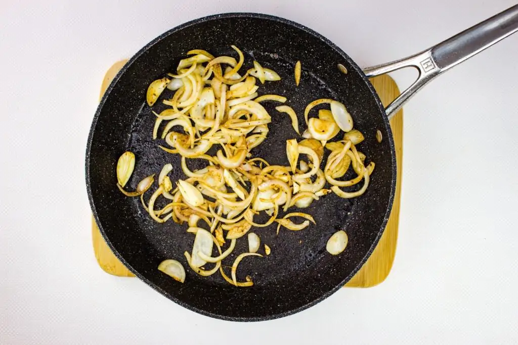 frying the onions and garlic in a skillet until tender to make hungarian keto goulash