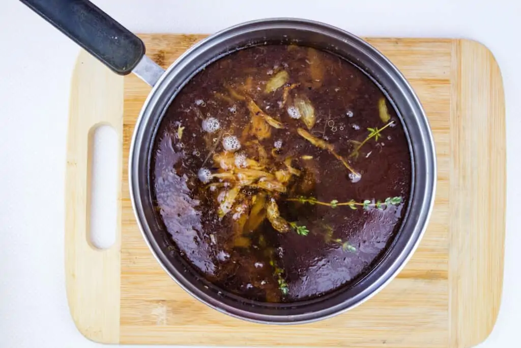 keto french onion soup ingredients in a pot ready for simmering