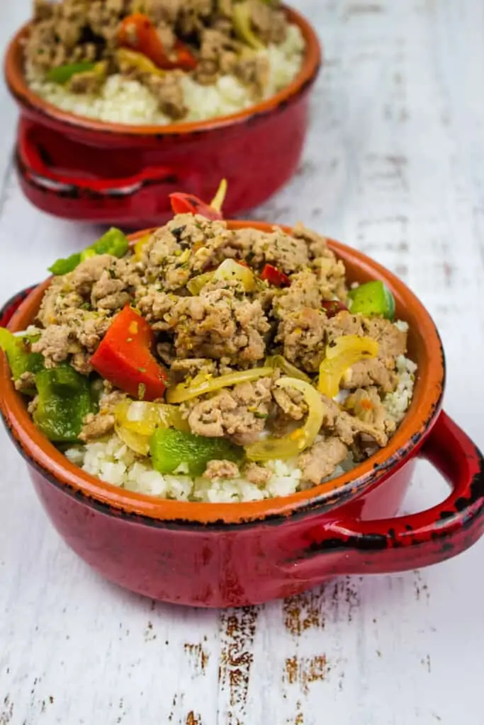 keto turkey and peppers in a red rustic bowl with a second in the background