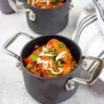 two individual size pots filled with keto sausage stew