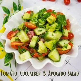 tomato cucumber and avocado salad in a bowl