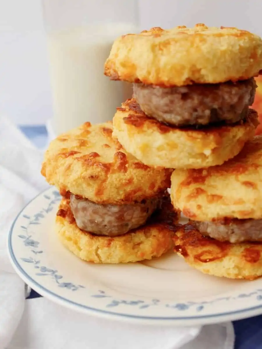keto breakfast sausage biscuits stacked on a plate