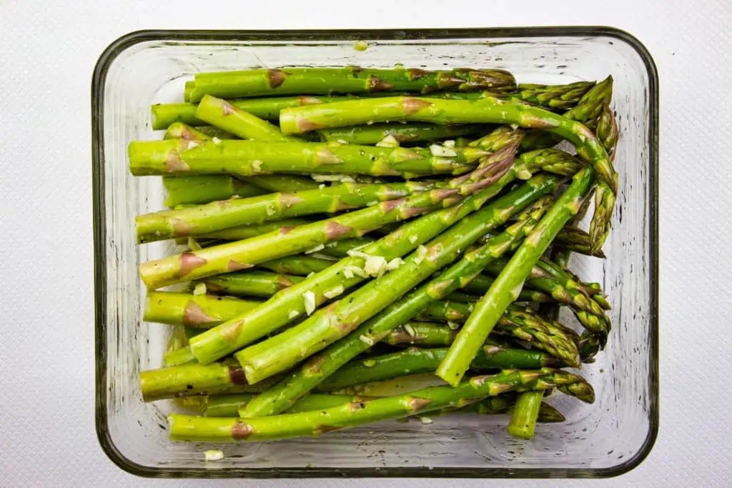 Asparagus tossed with oil, salt and pepper, and garlic.