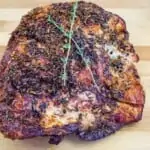 whole air fryer turkey breast resting on a cutting board