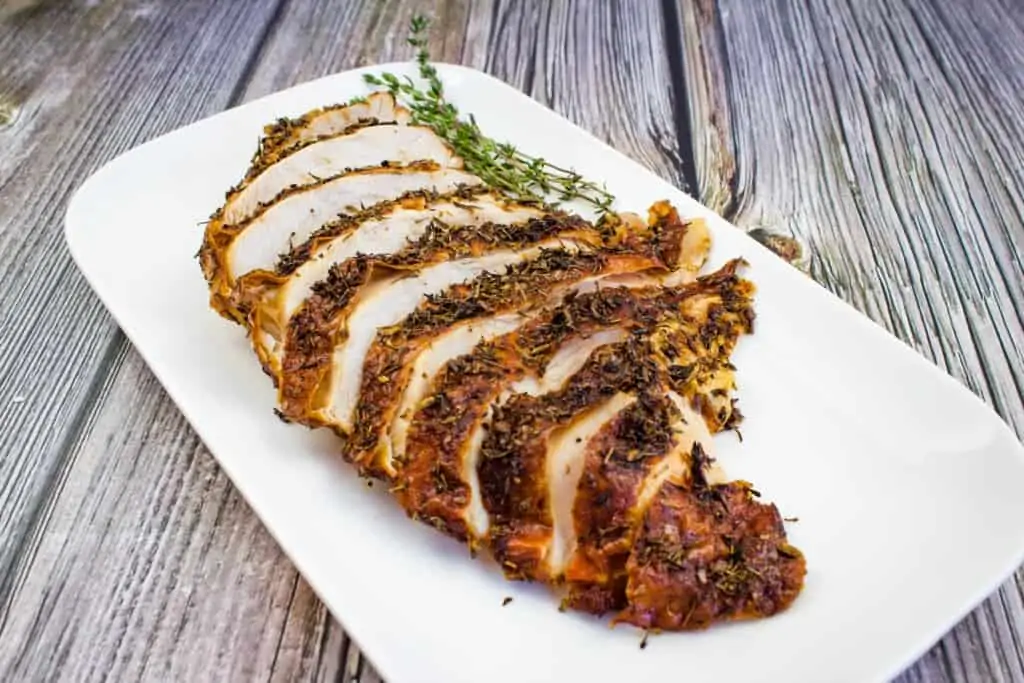 sliced air fryer turkey breast on a white platter