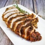 sliced air fryer turkey breast on a white platter