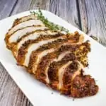 sliced air fryer turkey breast on a white platter