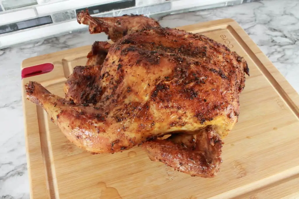 roasted cajun chicken on a cutting board