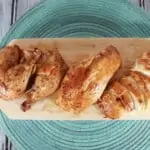roasted cajun chicken on a cutting board