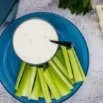 Keto Blue Cheese Dressing in a bowl with veggies nearby