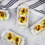 keto deviled eggs with bacon in small serving dishes