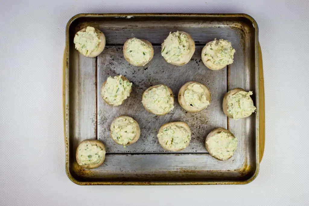 mixture stuffed into the mushroom caps and ready for the oven