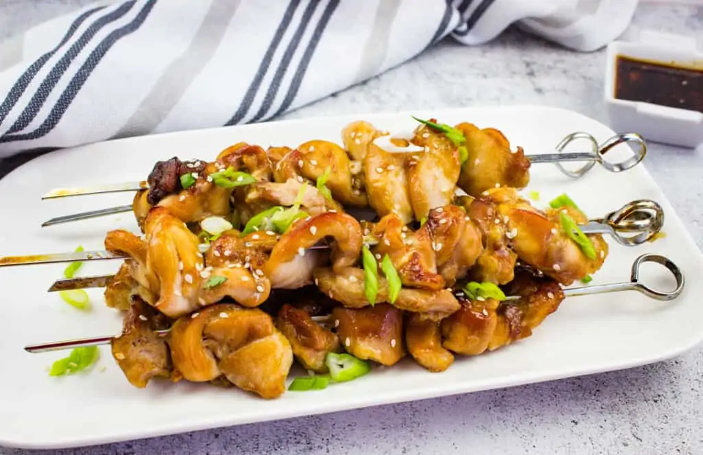 keto chicken teriyaki skewers on a white plate