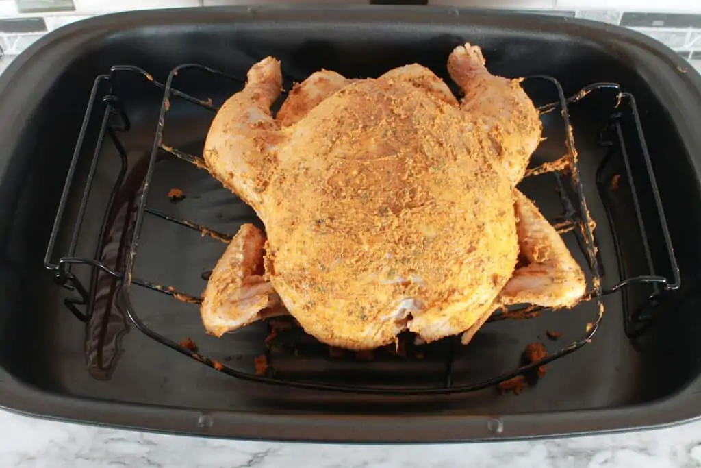 chicken on a rack ready for roasting