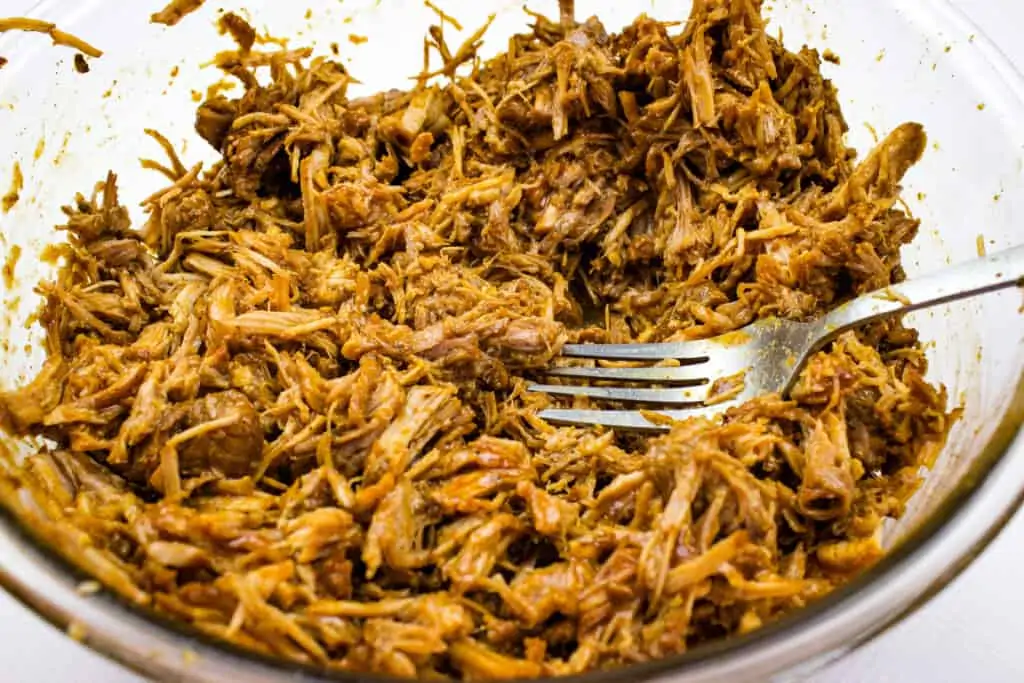 sherd the keto pulled pork with a fork
