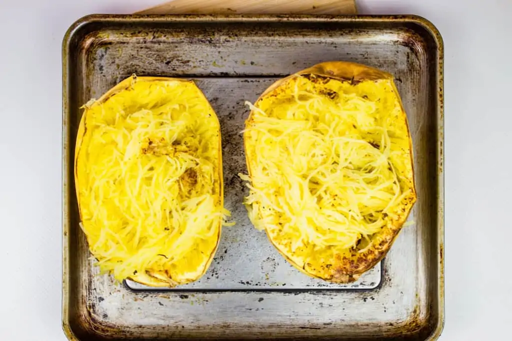 spaghetti squash on a tray that's been fluffed with a fork