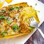 air fryer spaghetti squash with parmesan with a fork on a platter