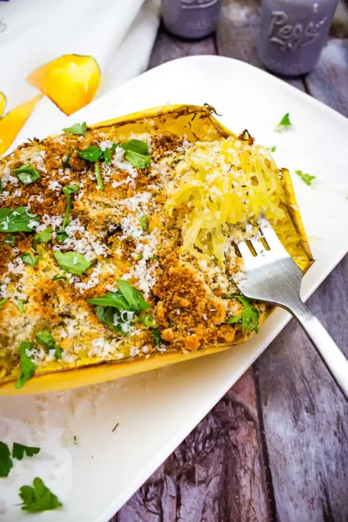 air fryer spaghetti squash with parmesan with a fork on a platter