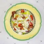 keto wedge salad on a yellow plate