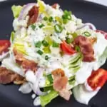 keto wedge salad on a black plate