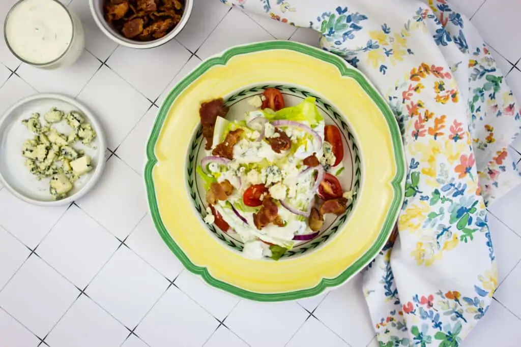 keto wedge salad on a yellow plate