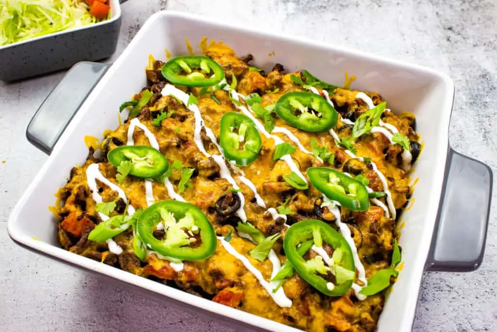 beefy keto taco casserole in a square casserole dish