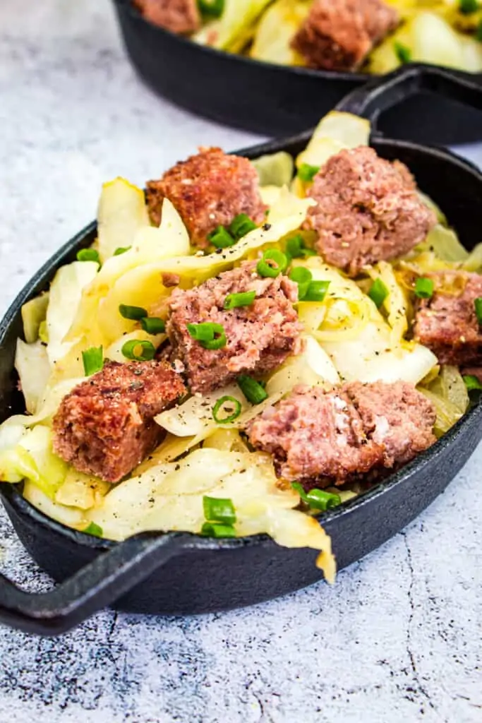 canned corned beef and cabbage in cast iron pans