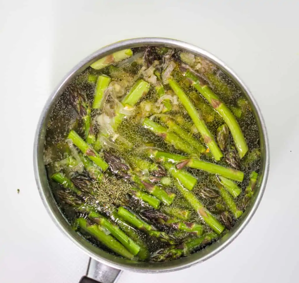 simmering asparagus in stock