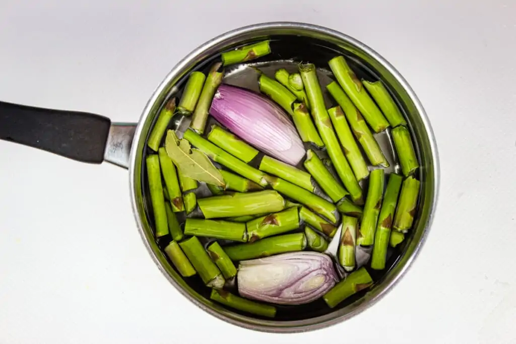making the broth with asparagus ends and shallot