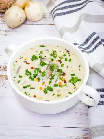 keto cream of mushroom soup in a white soup bowl