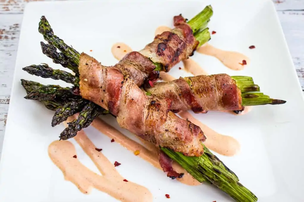 bacon-wrapped grilled asparagus on a plate