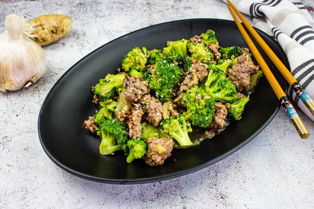 keto ground beef and broccoli on a black plate