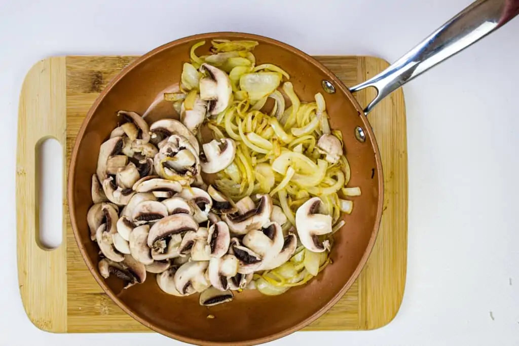 sauteeing the onions and mushrooms