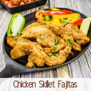 chicken skillet fajitas on a black plate