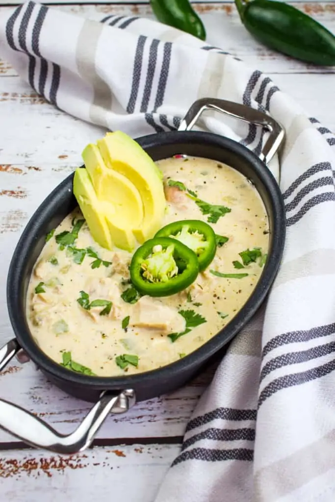 keto white chicken chili in a black dish